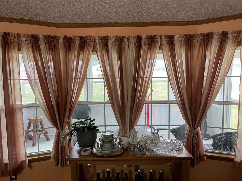 168 Big Rock Road Berlin, PA 15530 - Photo 19 of 25 a view of a living room with a floor to ceiling window and tree