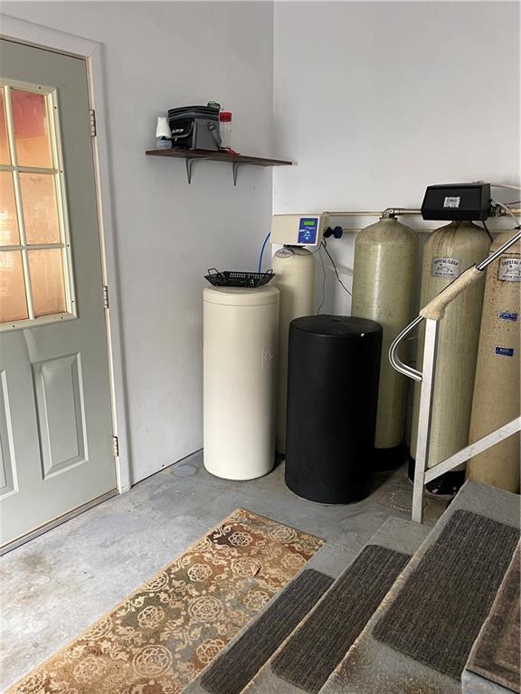 168 Big Rock Road Berlin, PA 15530 - Photo 23 of 25 a room with water heater and wooden cabinets