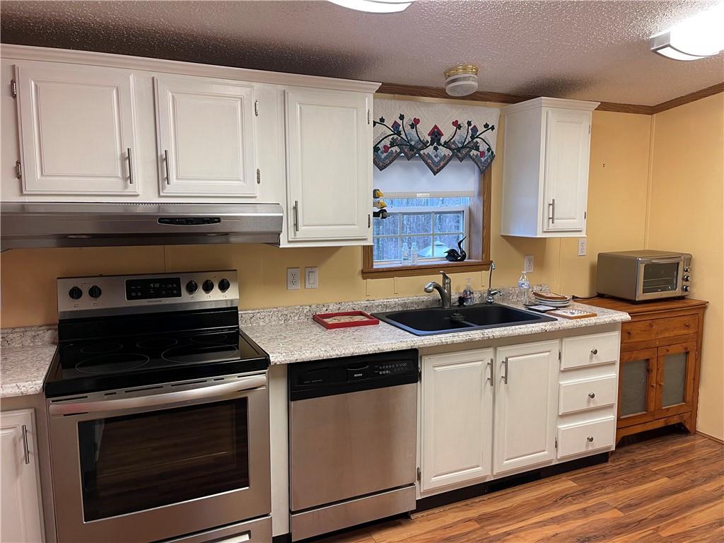 168 Big Rock Road Berlin, PA 15530 - Photo 10 of 25 a kitchen with stainless steel appliances granite countertop a stove and a microwave