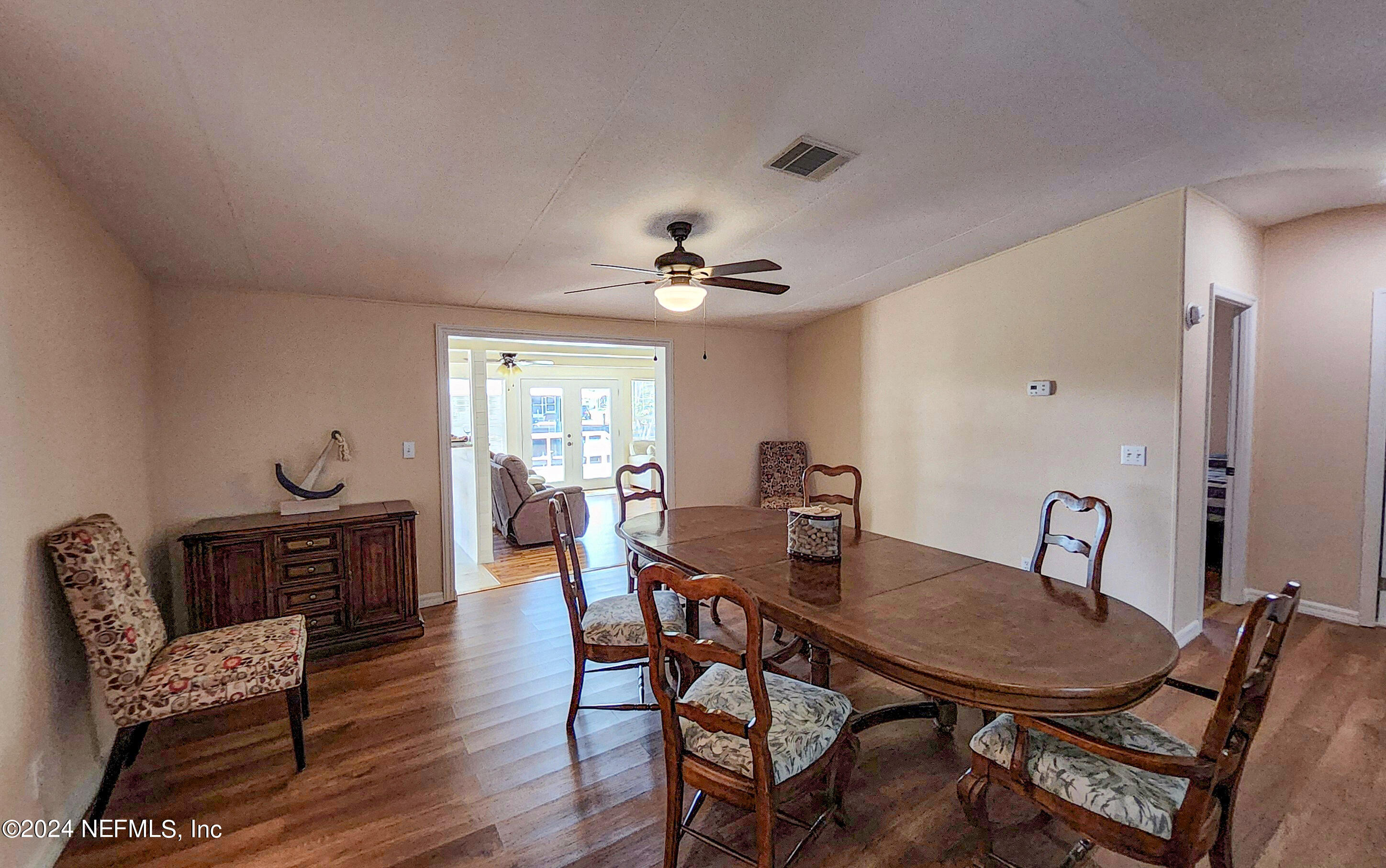 44 Scott Welaka, FL 32193 - Photo 17 of 35 a view of a dining room with furniture and wooden floor