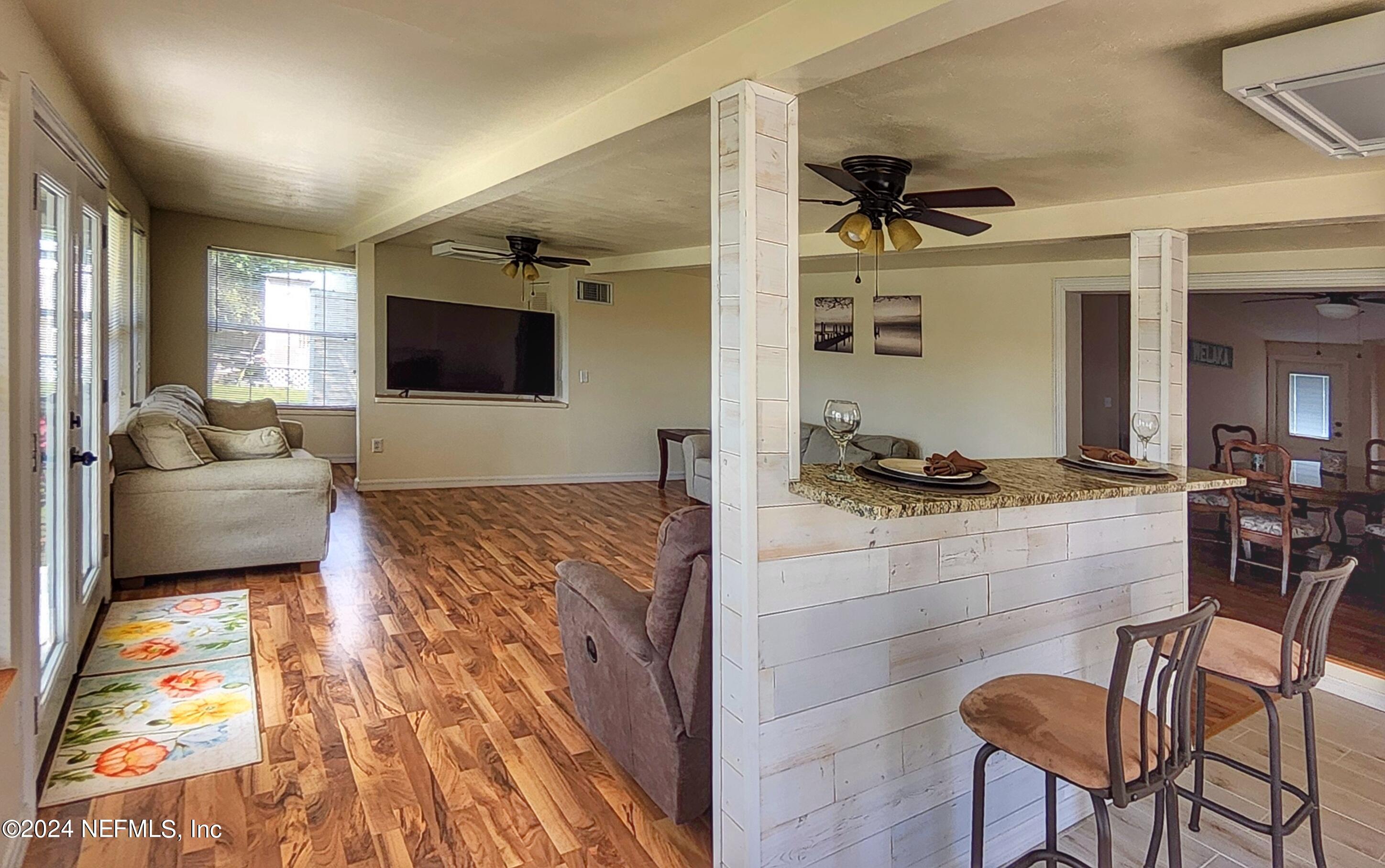 44 Scott Welaka, FL 32193 - Photo 27 of 35 a living room with furniture and a flat screen tv