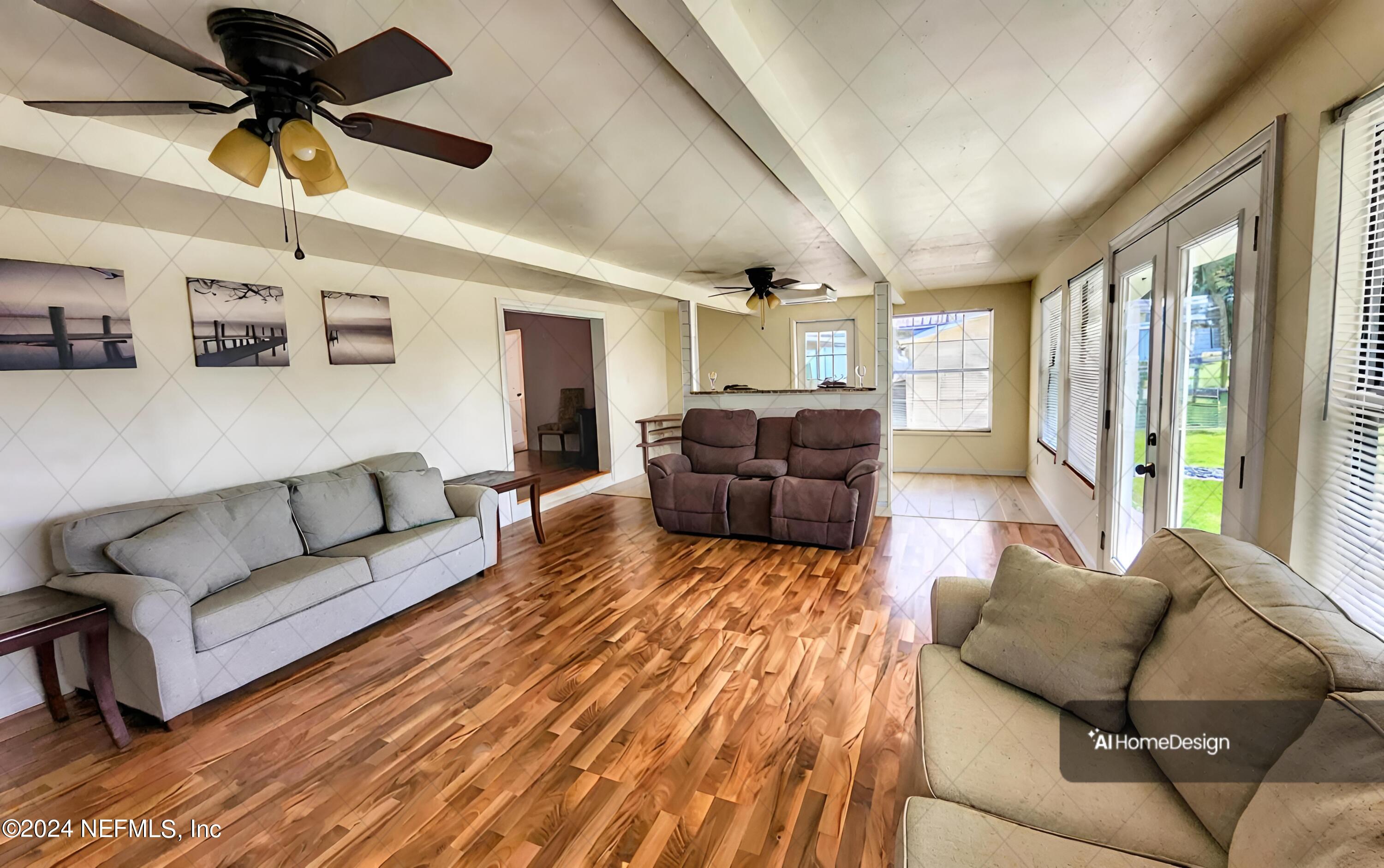 44 Scott Welaka, FL 32193 - Photo 28 of 35 a living room with furniture and a large window