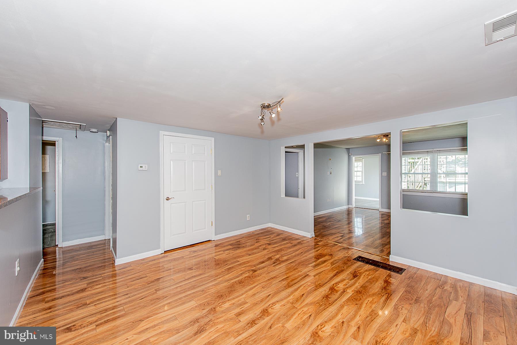 2413 Brunswick Road Baltimore, MD 21227 - Photo 11 of 30 Dining Room With Exotic Walnut Laminate Floors