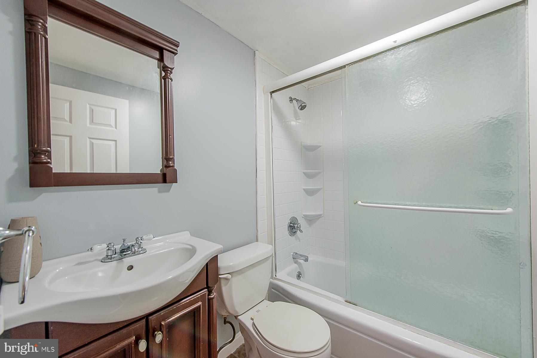 2413 Brunswick Road Baltimore, MD 21227 - Photo 14 of 30 Bath With Sliding Shower Glass Doors