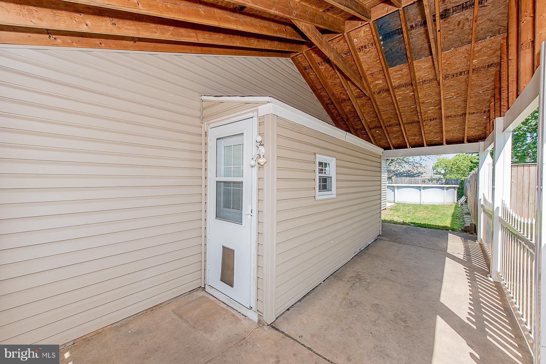 2413 Brunswick Road Baltimore, MD 21227 - Photo 28 of 30 Breezeway / Patio to back yard pool area