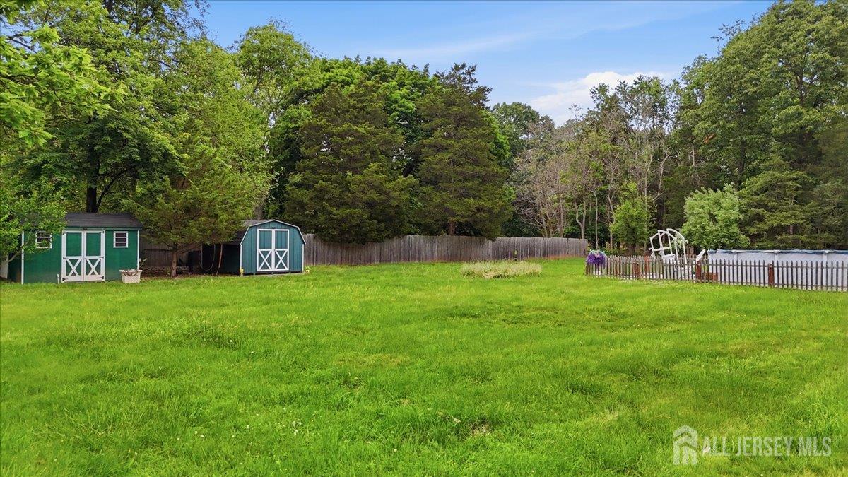 33 Ellison Road Somerset, NJ 08873 - Photo 21 of 38 a view of a tiny house with a yard and sitting area