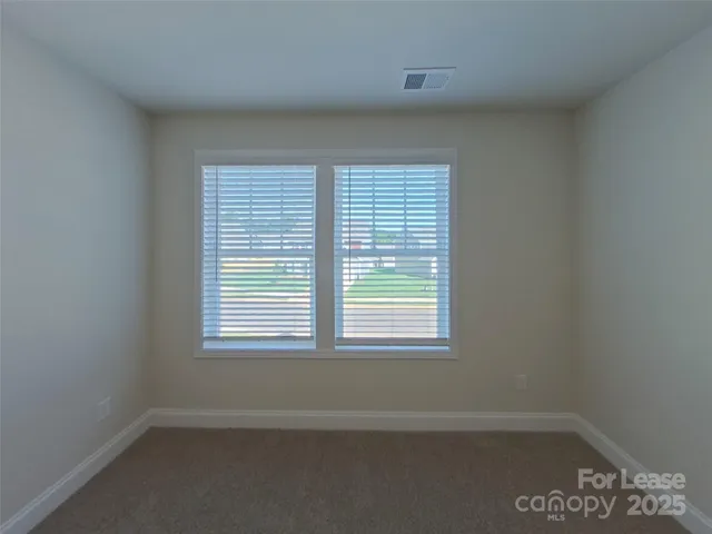 a bathroom with a granite countertop sink a shower and a mirror