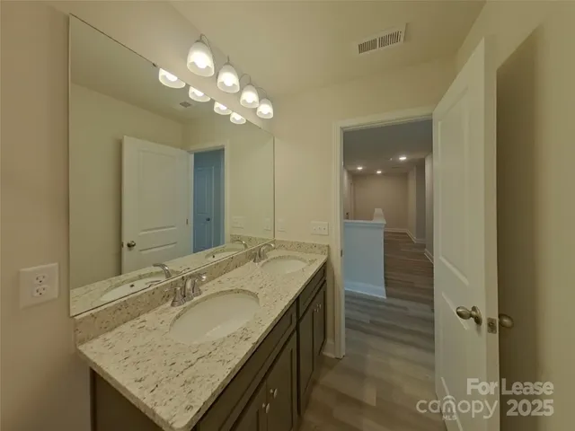 a bathroom with a shower and a bath tub