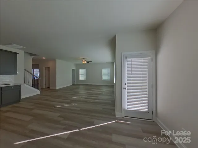 a view of hallway with wooden floor