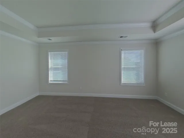 a spacious bathroom with a double vanity sink a mirror and a shower