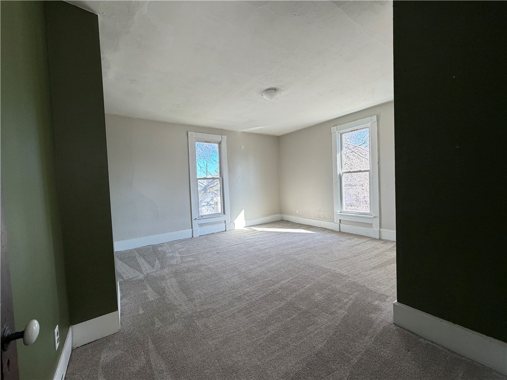 230 West Decatur Street Eaton, OH 45320 - Photo 13 of 22 This airy room features ample natural light and plush carpeting, perfect for relaxation.