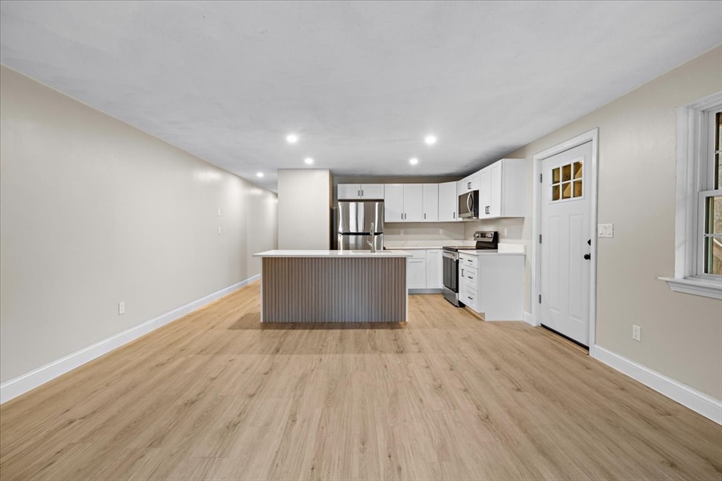 35 Ashumet Road, Unit 11B Mashpee, MA 02649 - Photo 13 of 24 a view of kitchen with wooden floor