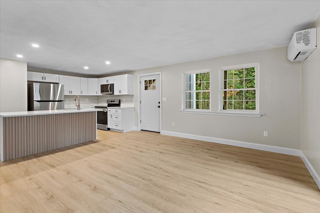35 Ashumet Road, Unit 11B Mashpee, MA 02649 - Photo 14 of 24 a view of a kitchen with a sink and windows