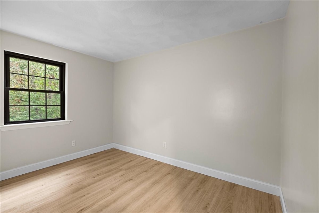 35 Ashumet Road, Unit 11B Mashpee, MA 02649 - Photo 20 of 24 wooden floor in an empty room with a window