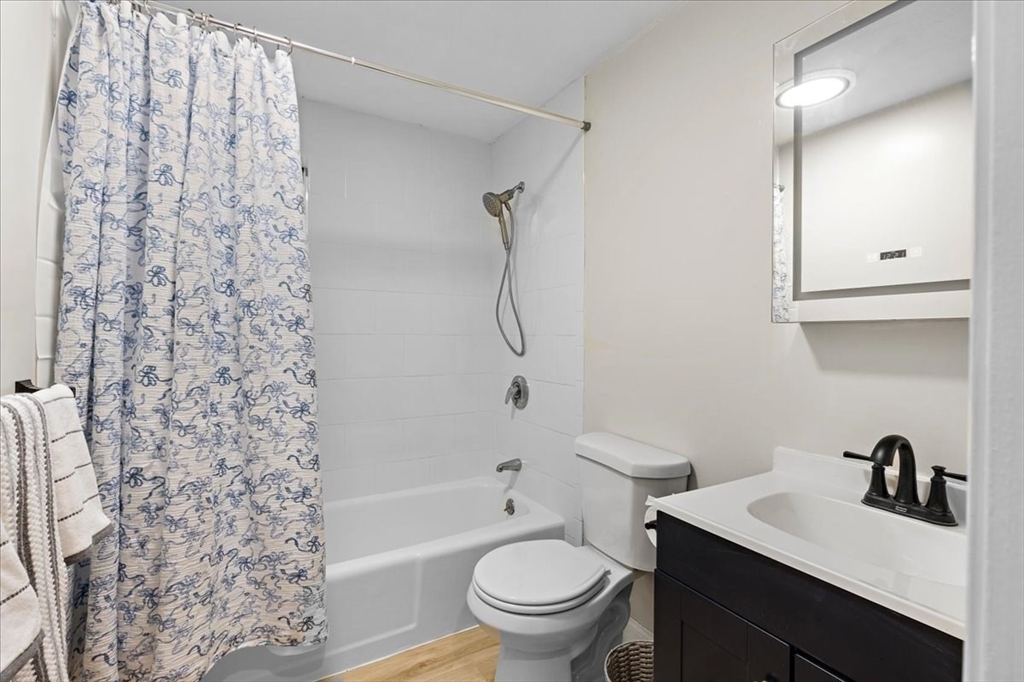 35 Ashumet Road, Unit 11B Mashpee, MA 02649 - Photo 23 of 24 a bathroom with a sink toilet vanity and shower