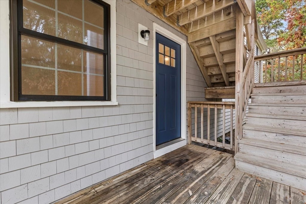 35 Ashumet Road, Unit 11B Mashpee, MA 02649 - Photo 5 of 24 a view of a house with a door and wooden floor