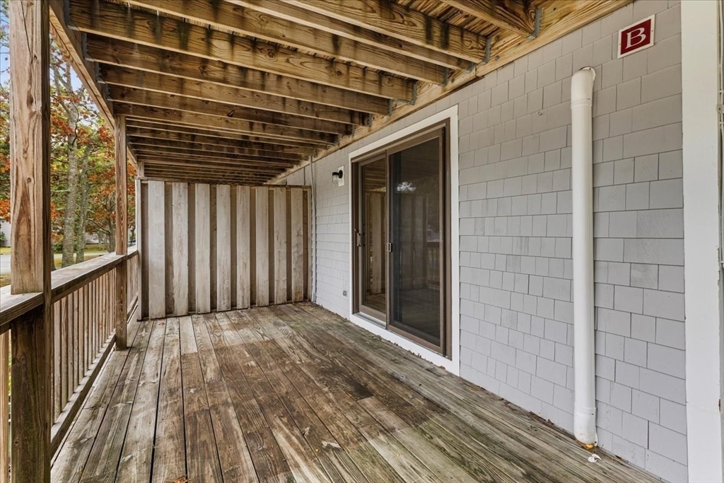 35 Ashumet Road, Unit 11B Mashpee, MA 02649 - Photo 6 of 24 a view of porch with wooden floor
