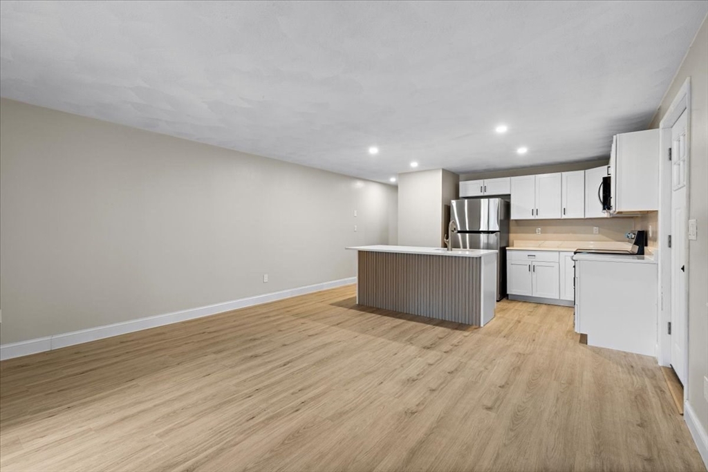 35 Ashumet Road, Unit 11B Mashpee, MA 02649 - Photo 8 of 24 a view of kitchen with wooden floor