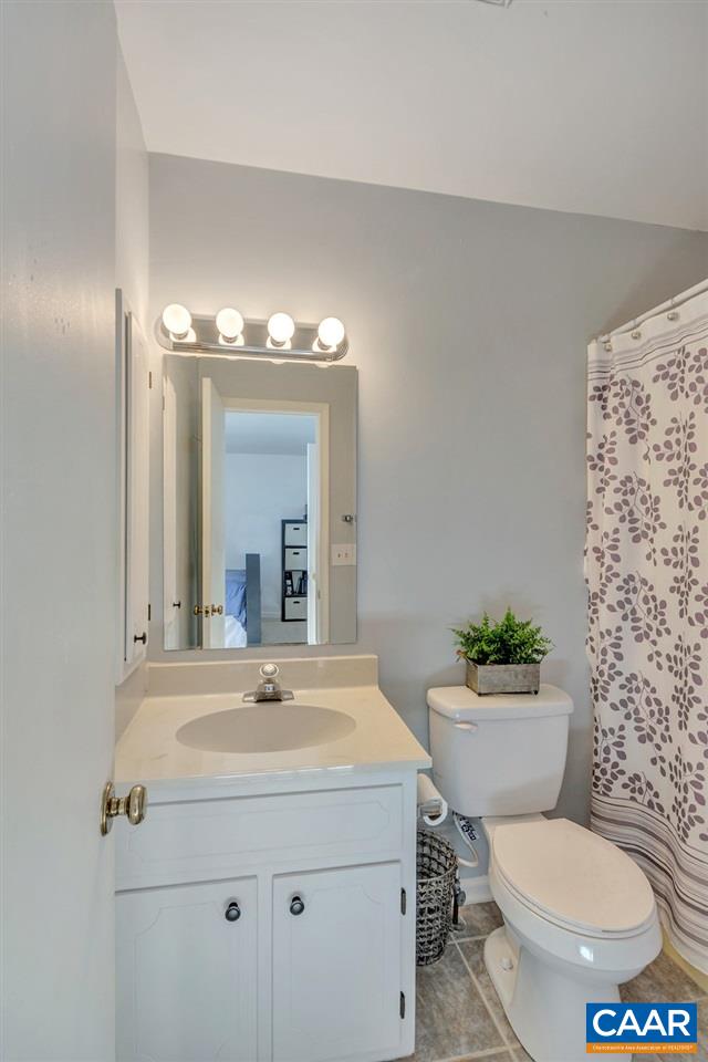 1554 Cool Spring Road Charlottesville, VA 22901 - Photo 20 of 21 a bathroom with a toilet a sink and mirror