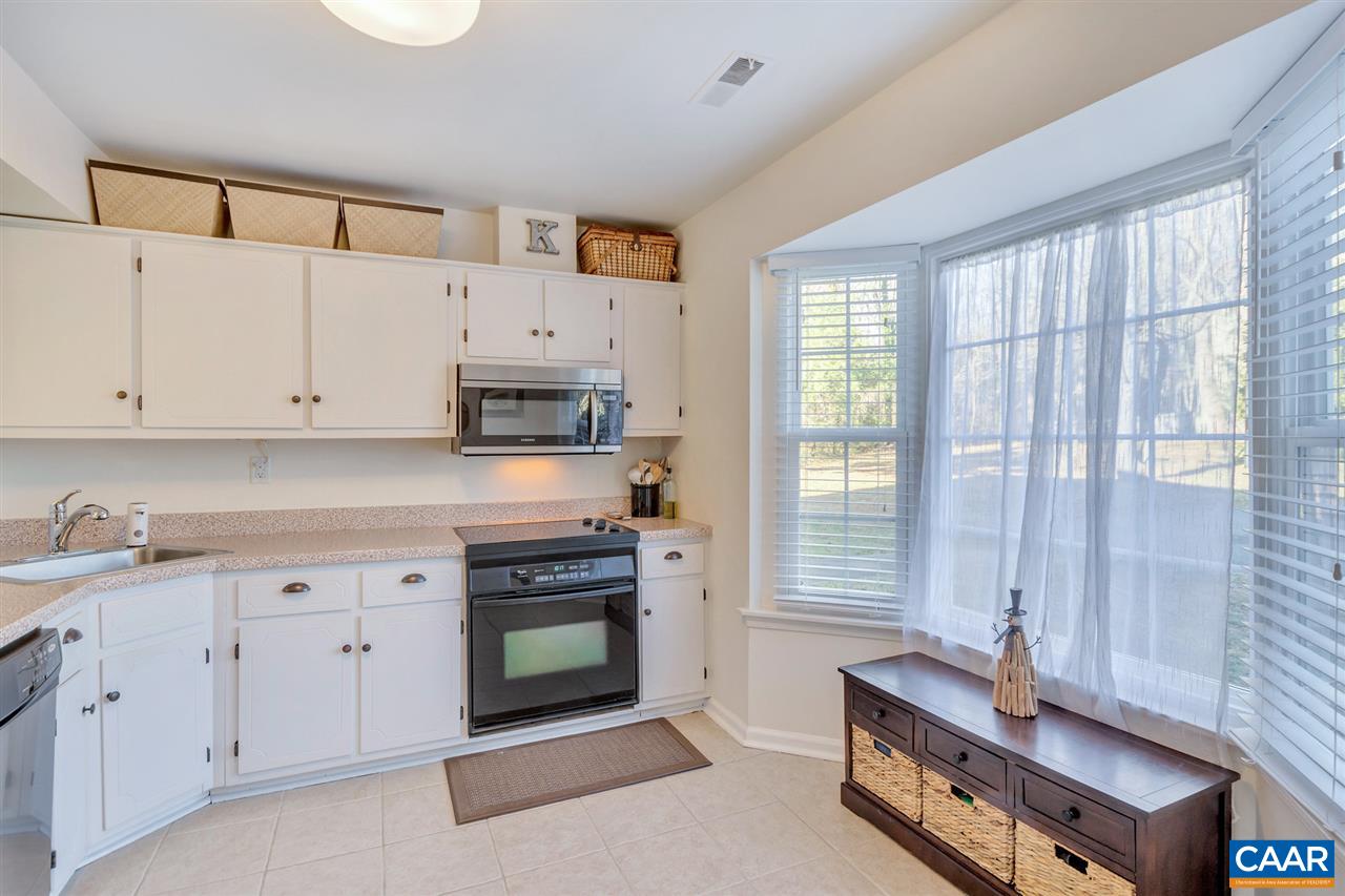 1554 Cool Spring Road Charlottesville, VA 22901 - Photo 5 of 21 a kitchen with stainless steel appliances white cabinets a sink and a stove