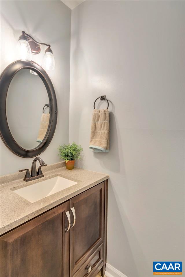 1554 Cool Spring Road Charlottesville, VA 22901 - Photo 9 of 21 a bathroom with a sink and a mirror