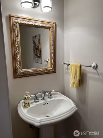 a living room with furniture a flat screen tv and a large window