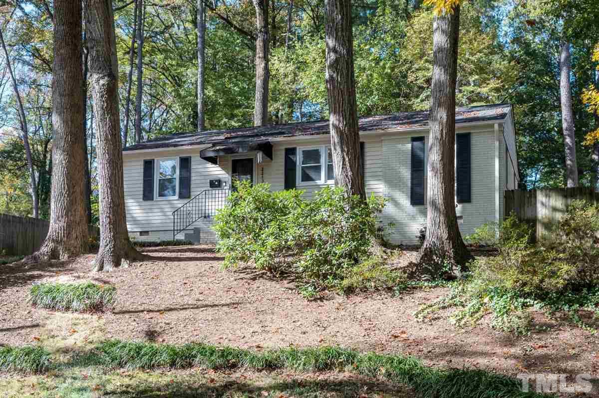 2213 Mossbank Road Raleigh, NC 27604 - Photo 2 of 28 a front view of a house with garden
