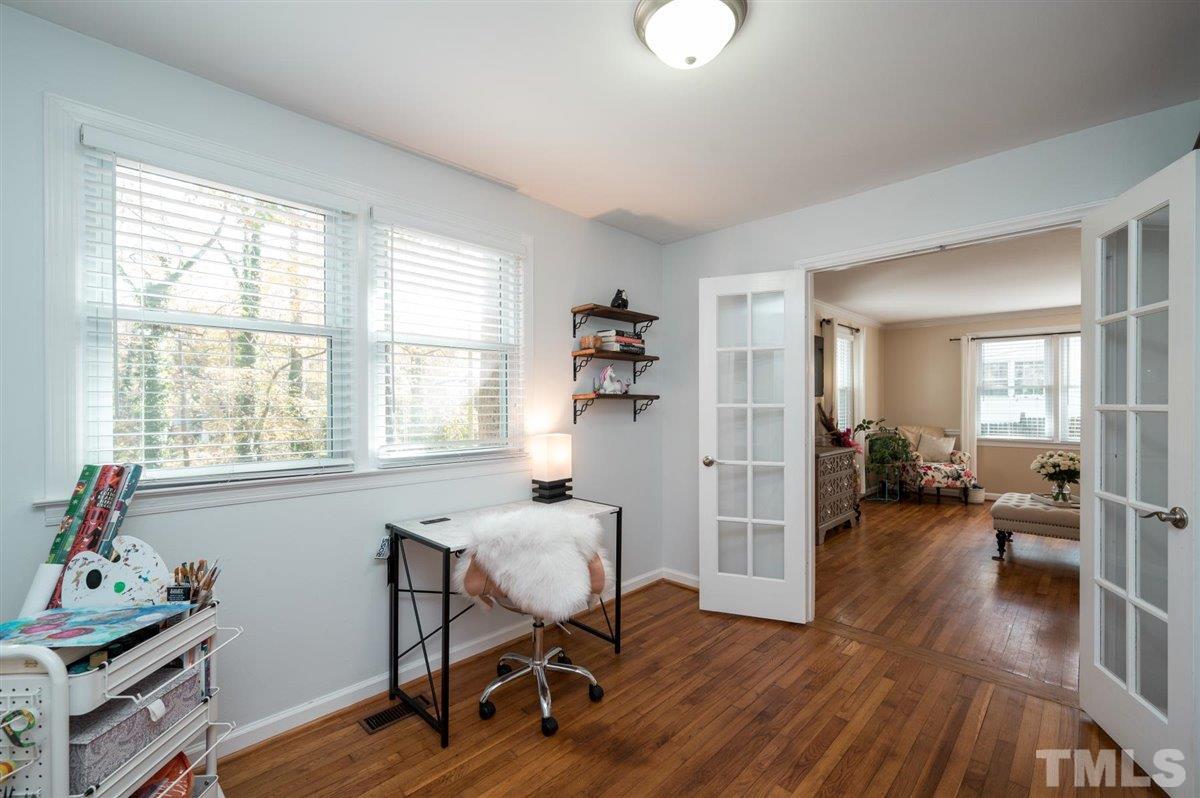 2213 Mossbank Road Raleigh, NC 27604 - Photo 11 of 28 a view of a livingroom with workspace and a window