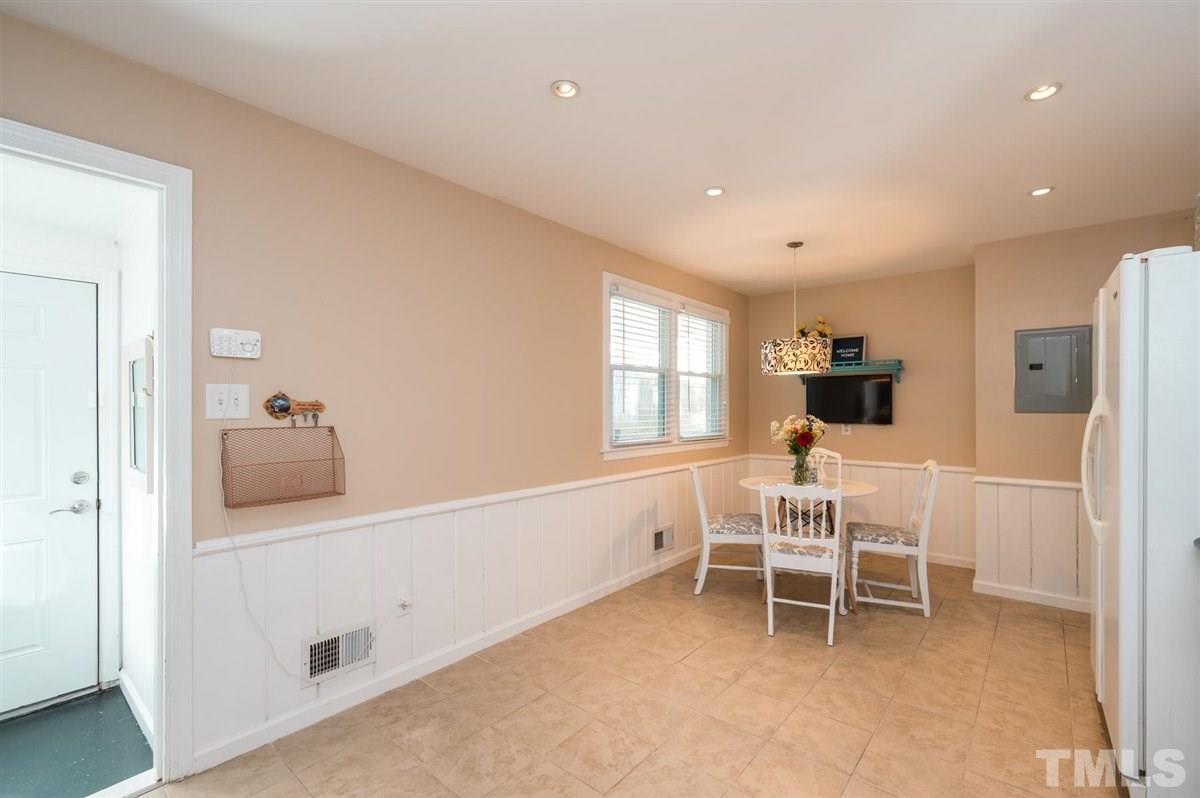 2213 Mossbank Road Raleigh, NC 27604 - Photo 15 of 28 a view of a hallway with chair and front door