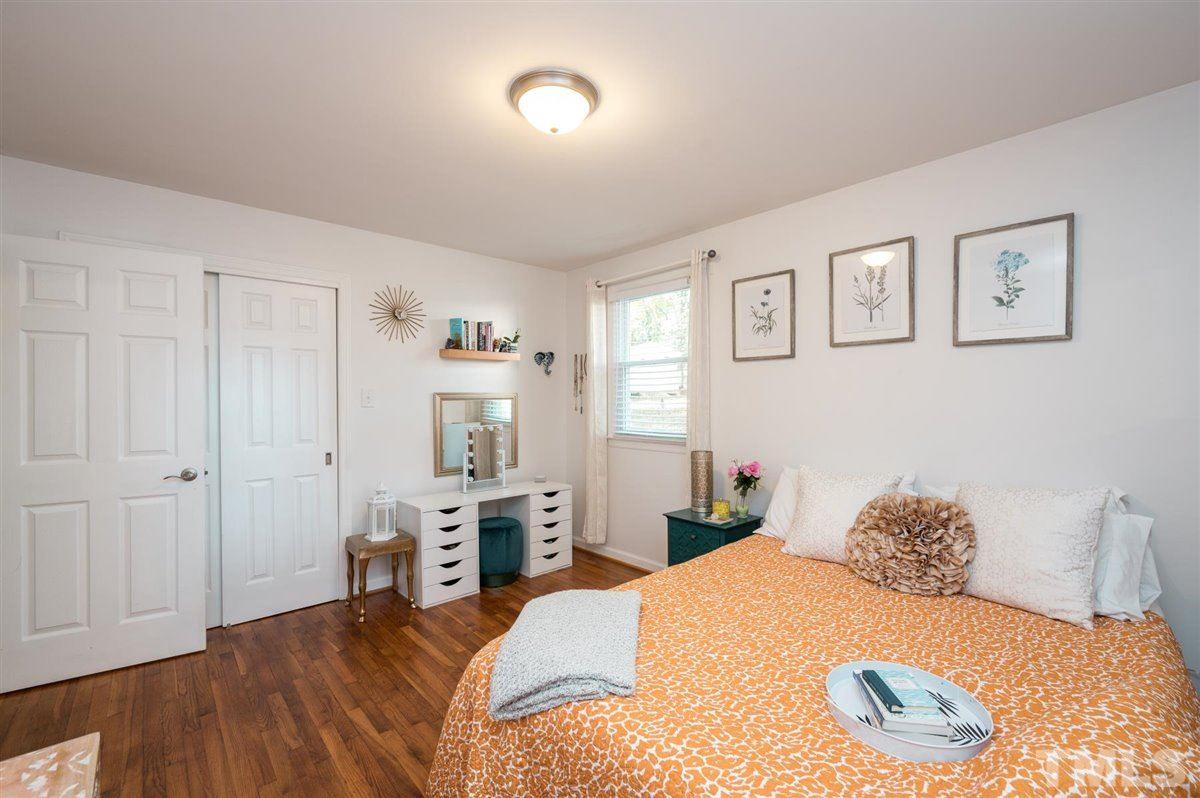 2213 Mossbank Road Raleigh, NC 27604 - Photo 19 of 28 a bedroom with a bed and a cabinets