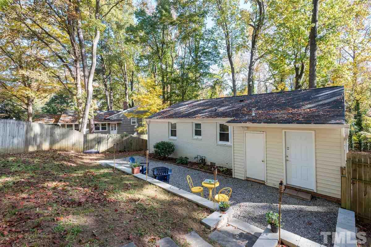 2213 Mossbank Road Raleigh, NC 27604 - Photo 27 of 28 a view of a house with backyard and tree