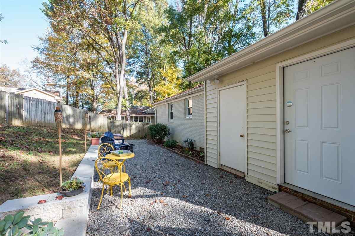2213 Mossbank Road Raleigh, NC 27604 - Photo 28 of 28 a view of a chair and tables in the backyard