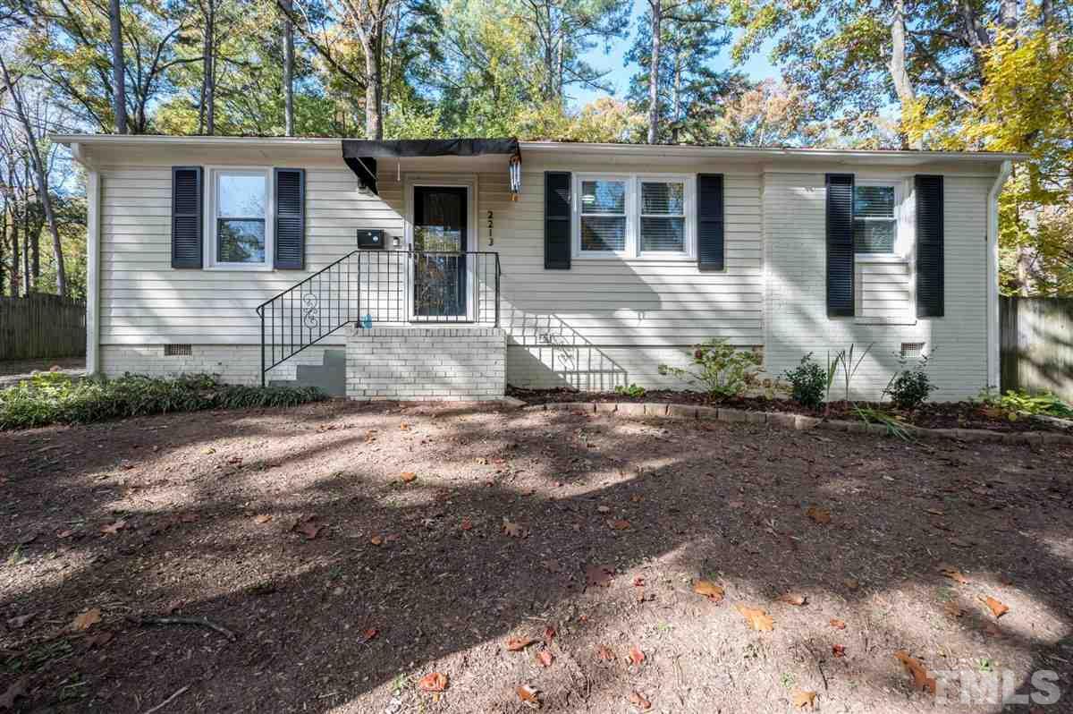 2213 Mossbank Road Raleigh, NC 27604 - Photo 4 of 28 a front view of a house with garden