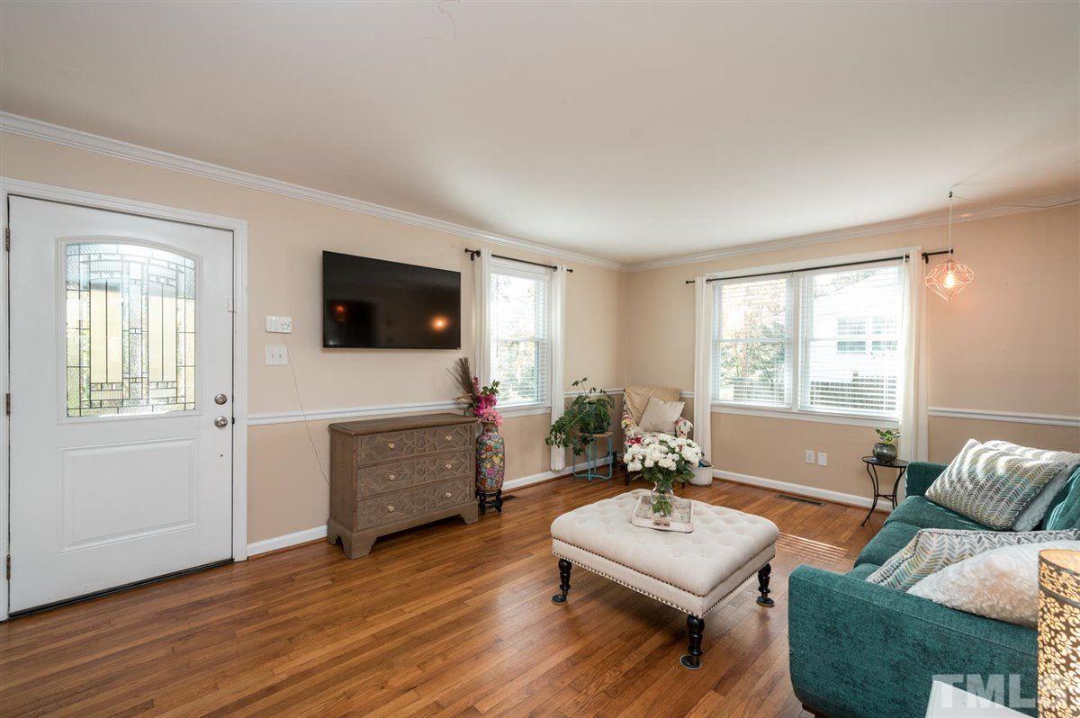 2213 Mossbank Road Raleigh, NC 27604 - Photo 5 of 28 a living room with furniture and a flat screen tv