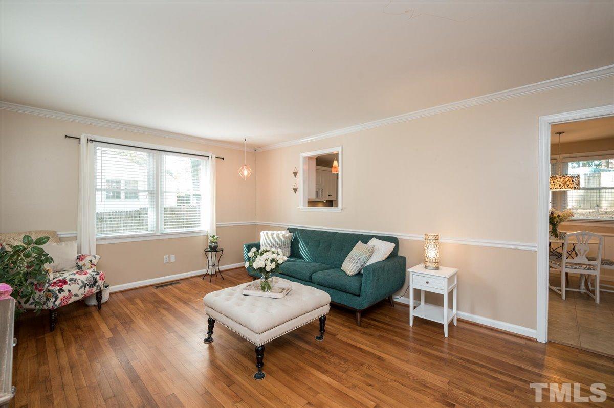 2213 Mossbank Road Raleigh, NC 27604 - Photo 6 of 28 a living room with furniture and a wooden floor
