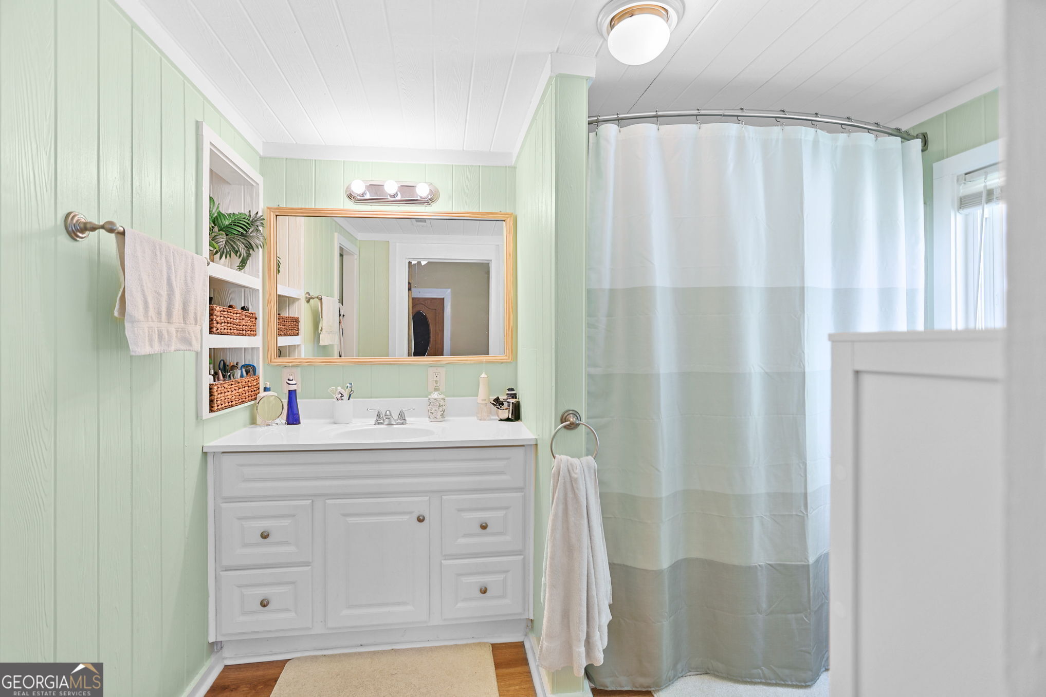 1205 Terrell Street Greenville, GA 30222 - Photo 15 of 50 a bathroom with a double vanity sink mirror and double