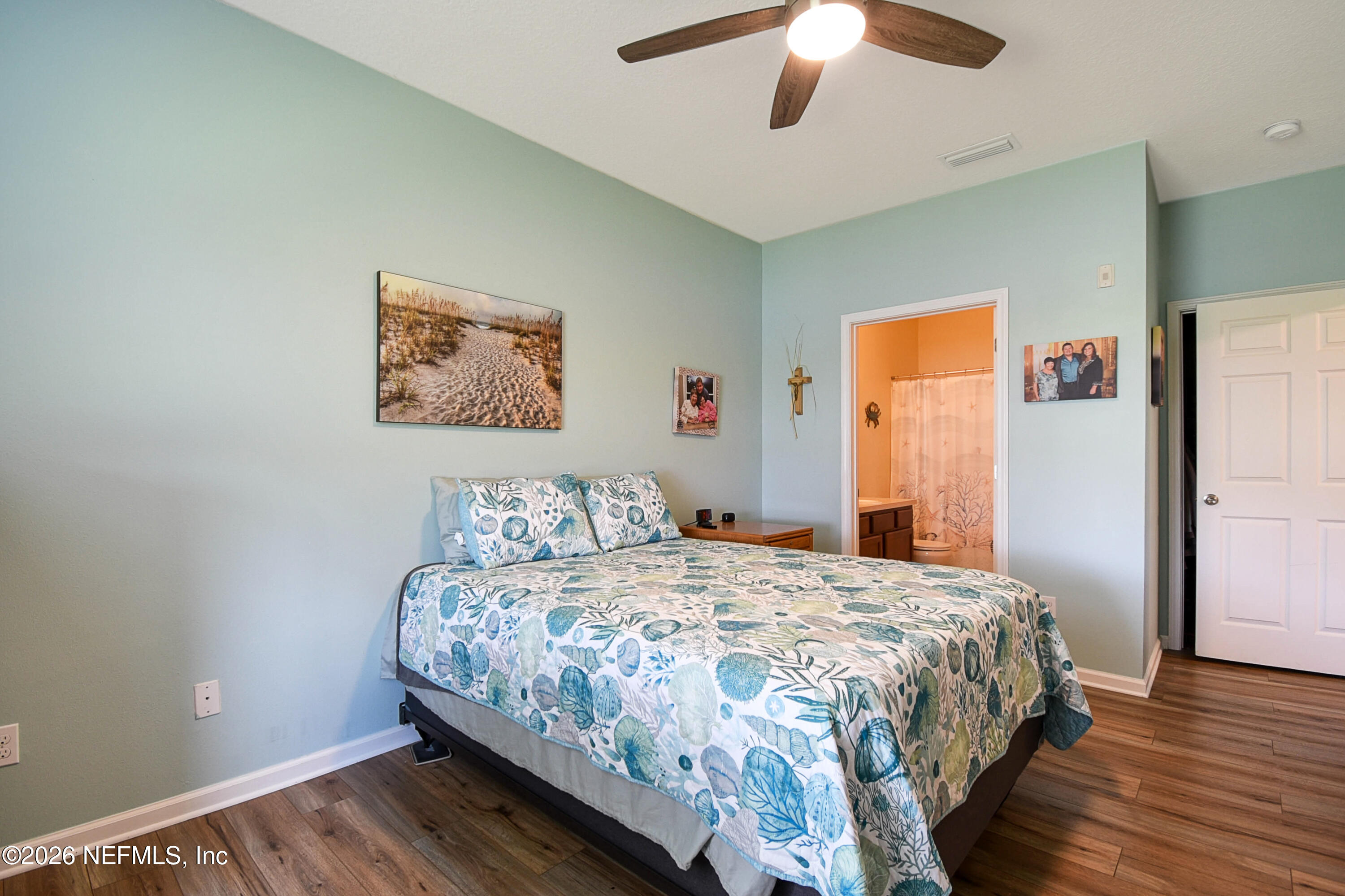 2334 Golden Lake Loop St. Augustine, FL 32084 - Photo 12 of 31 a bedroom with a bed and a chandelier