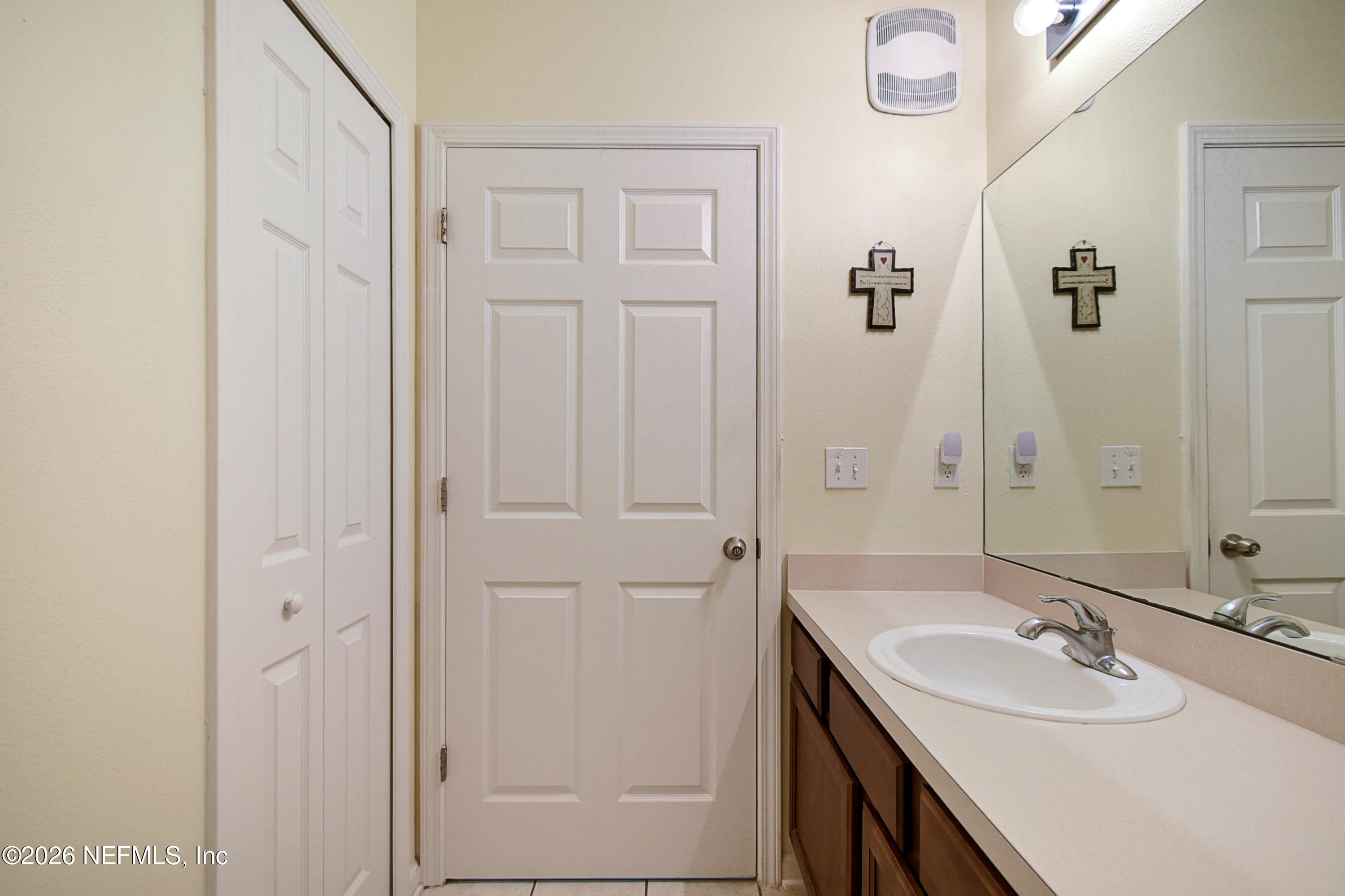 2334 Golden Lake Loop St. Augustine, FL 32084 - Photo 14 of 31 a bathroom with a double vanity sink and a mirror
