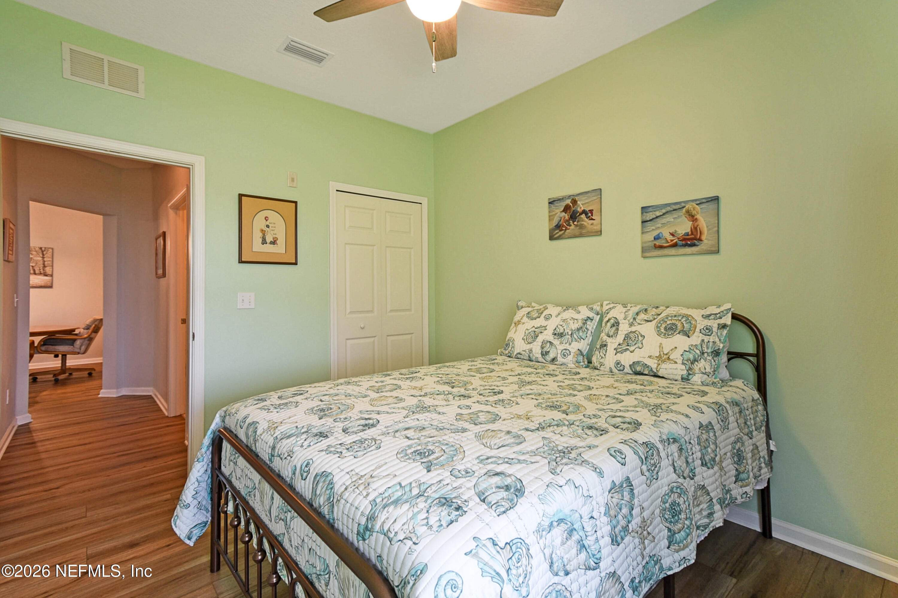 2334 Golden Lake Loop St. Augustine, FL 32084 - Photo 18 of 31 a bedroom with a bed and wooden floor