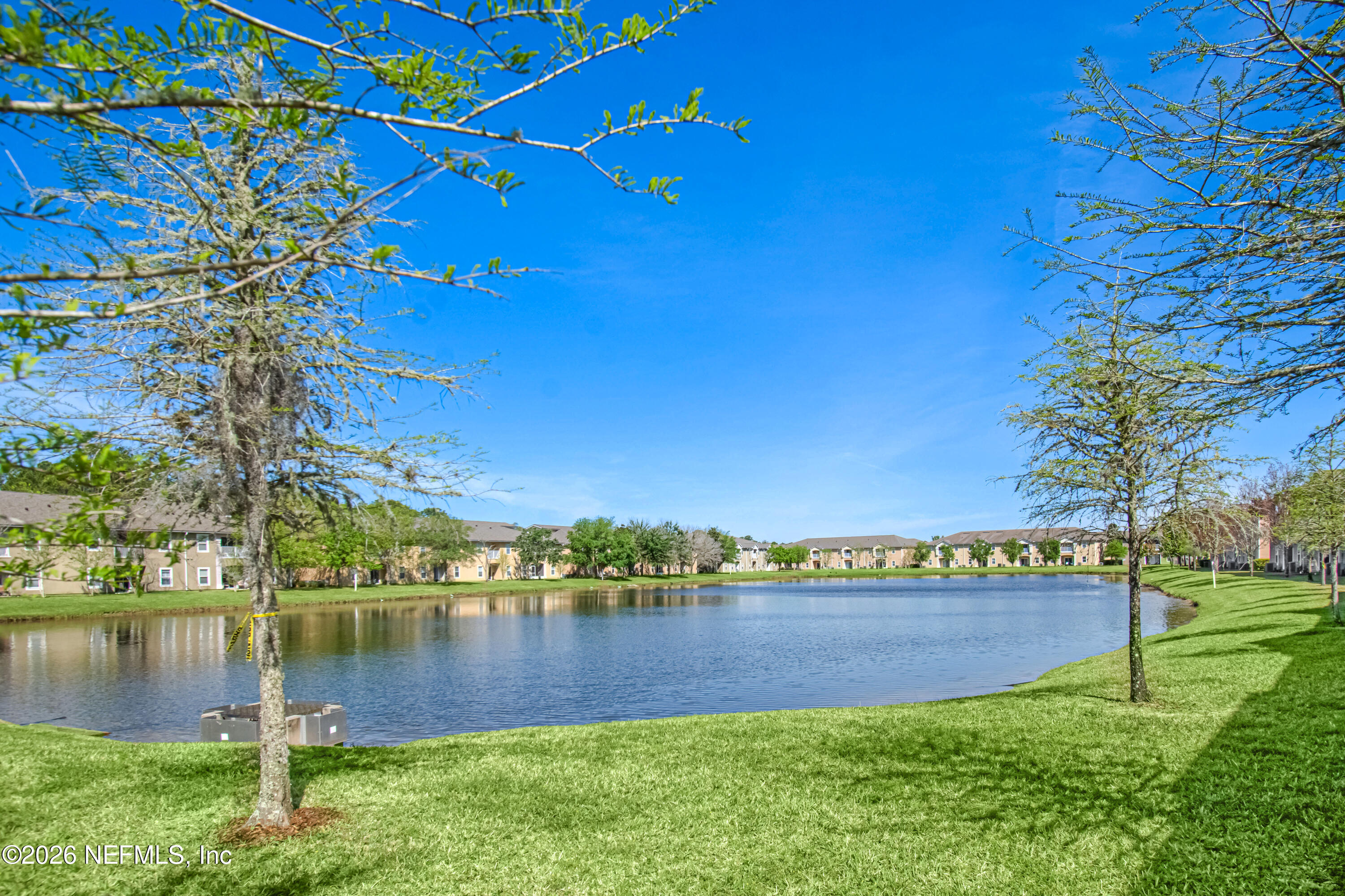 2334 Golden Lake Loop St. Augustine, FL 32084 - Photo 27 of 31 a view of a lake with houses in the back