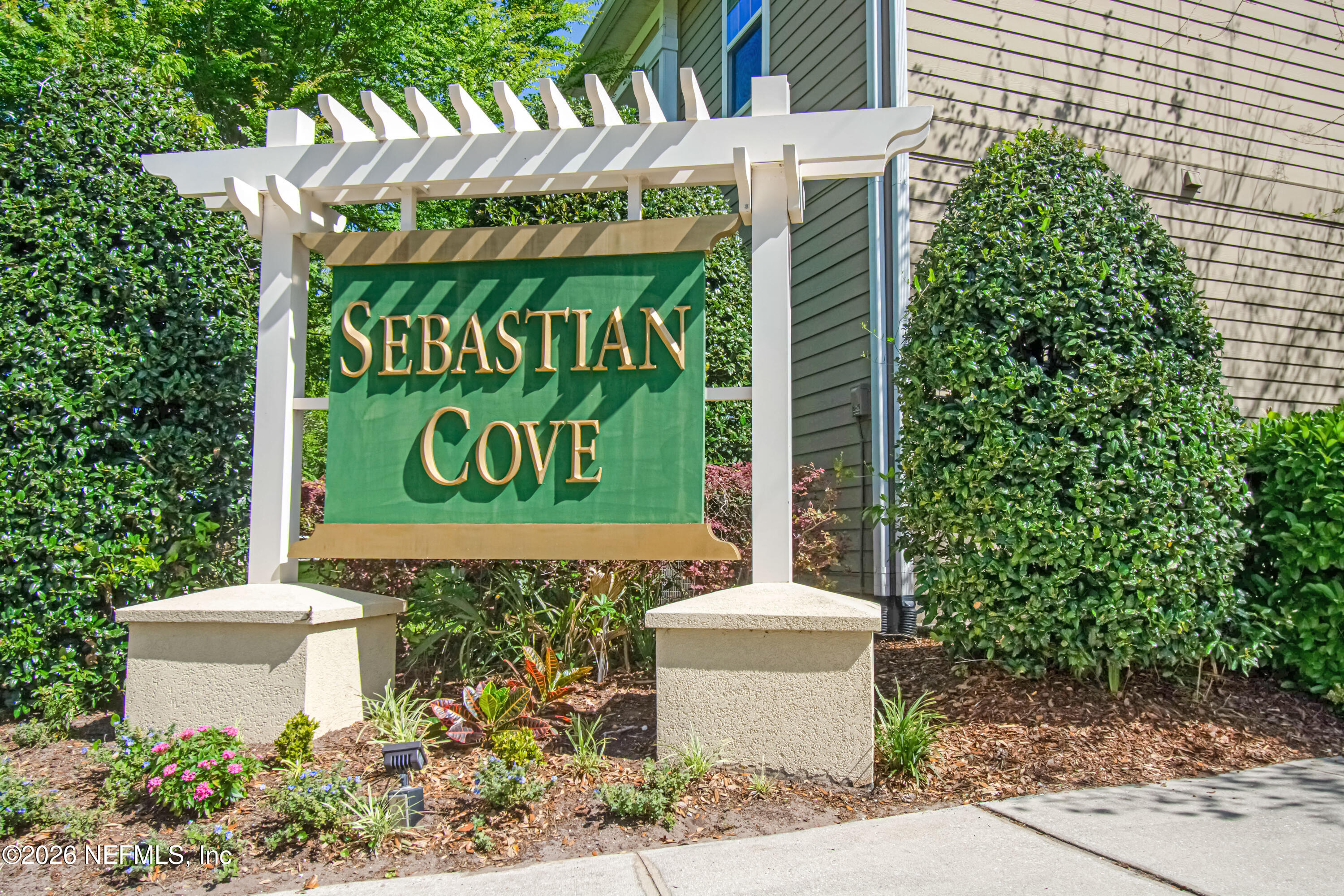 2334 Golden Lake Loop St. Augustine, FL 32084 - Photo 30 of 31 a sign that is in front of flowers