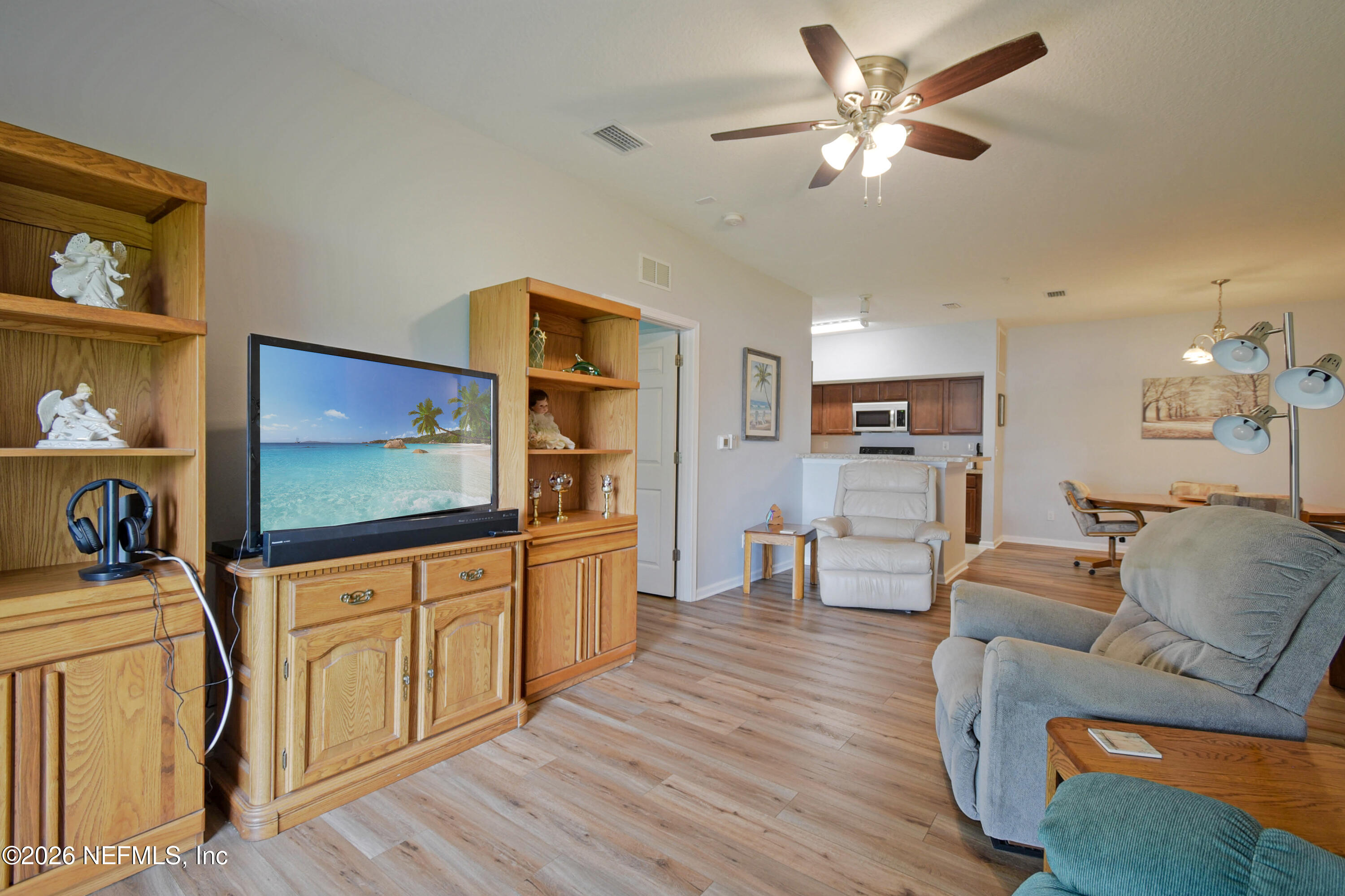 2334 Golden Lake Loop St. Augustine, FL 32084 - Photo 4 of 31 a living room with furniture and a flat screen tv
