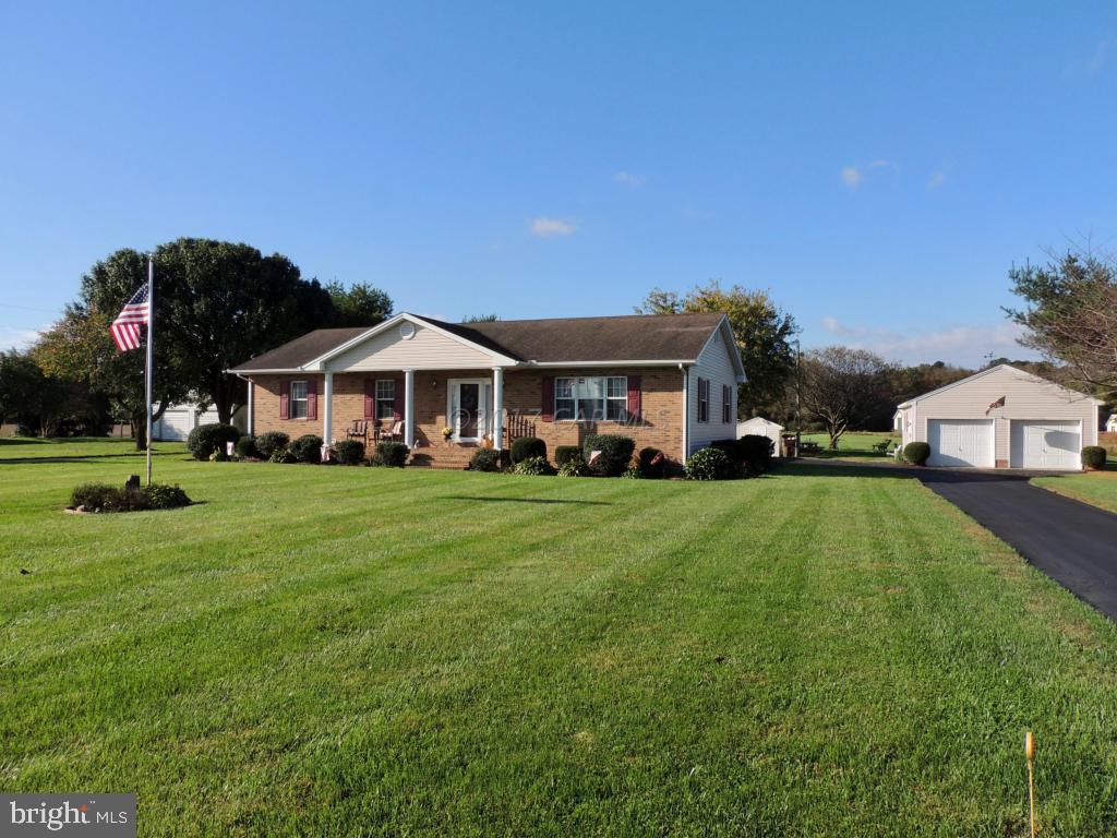 6782 Bent Pine Road Willards, MD 21874 - Photo 2 of 21 a front view of a house with a yard