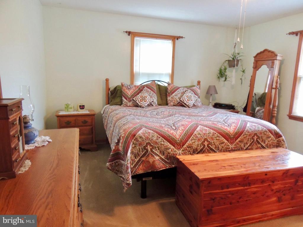 6782 Bent Pine Road Willards, MD 21874 - Photo 12 of 21 a bedroom with a bed and a window