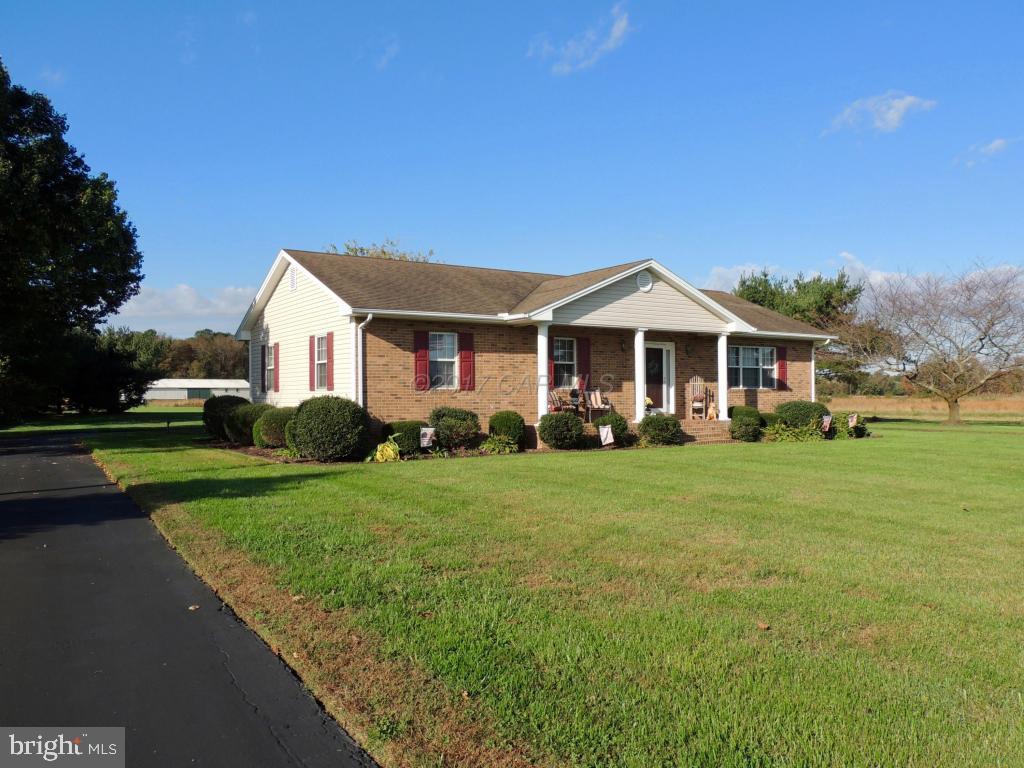 6782 Bent Pine Road Willards, MD 21874 - Photo 3 of 21 a front view of a house with a yard