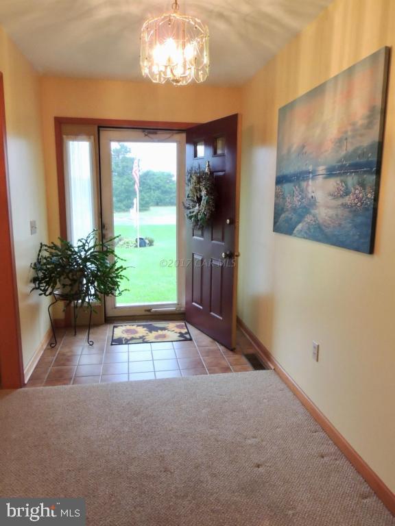 6782 Bent Pine Road Willards, MD 21874 - Photo 4 of 21 a view of a room with a large window and wooden floor