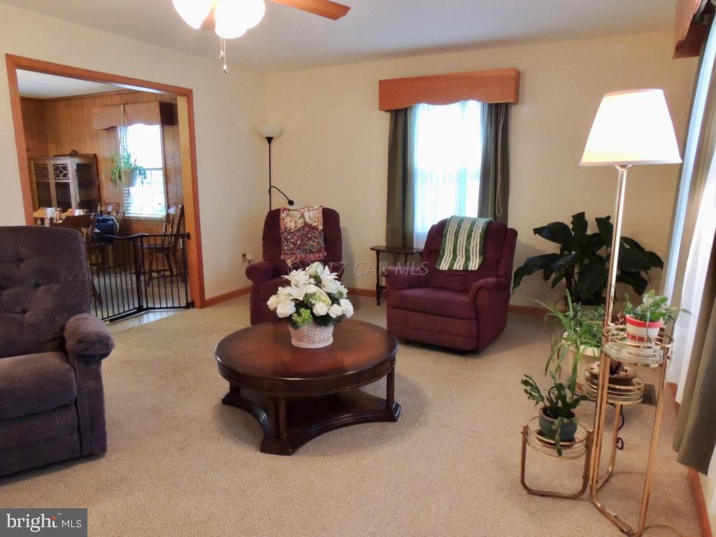 6782 Bent Pine Road Willards, MD 21874 - Photo 9 of 21 a living room with furniture and a flat screen tv