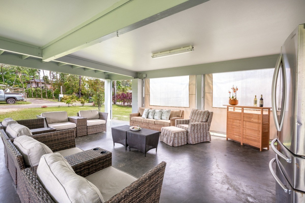 5527 Weke Road Hanalei, HI 96714 - Photo 19 of 28 a living room with fireplace furniture and a large window