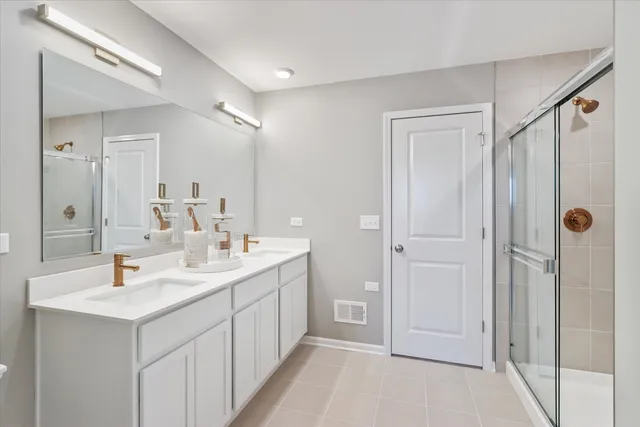 a bathroom with a double vanity sink and mirror