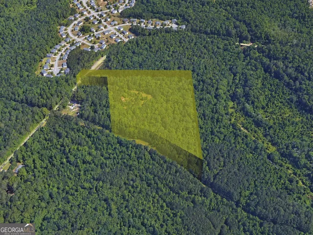 a sign that is sitting in front of a tree